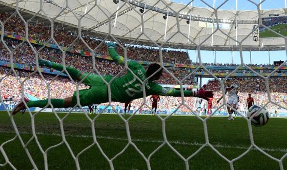 Portugal's goalkeeper Rui Patricio fails to save Germany's forward Thomas Mueller's penalty during the Group G football match between Germany and Portugal at the Fonte Nova Arena in Salvador during the 2014 FIFA World Cup on June 16, 2014. AFP PHOTO / PATRIK STOLLARZPATRIK STOLLARZ/AFP/Getty Images